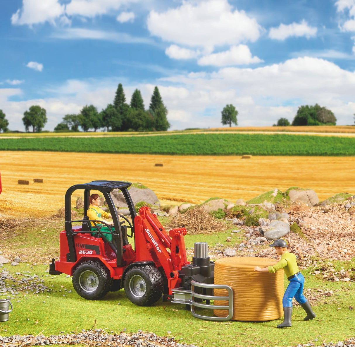 Schäffer Compact loader 2630 with bale gripper plus bale - Farm Toy