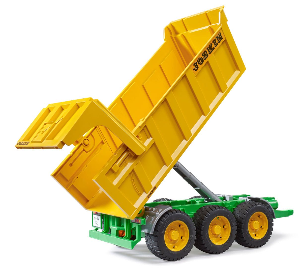 A yellow Joskin tipping trailer with a green chassis, featuring a folding tipping trough and three axles.