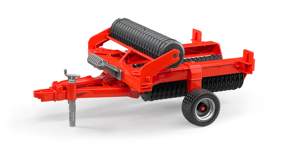 A red toy roller attachment, featuring a black wheel and a textured roller surface.