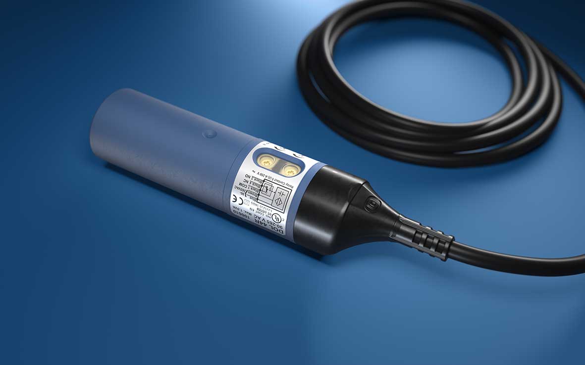 A 24 Volt capacitive sensor with a 30mm diameter, relay output, and a cable, designed for feed control in animals, with settings visible on the label.