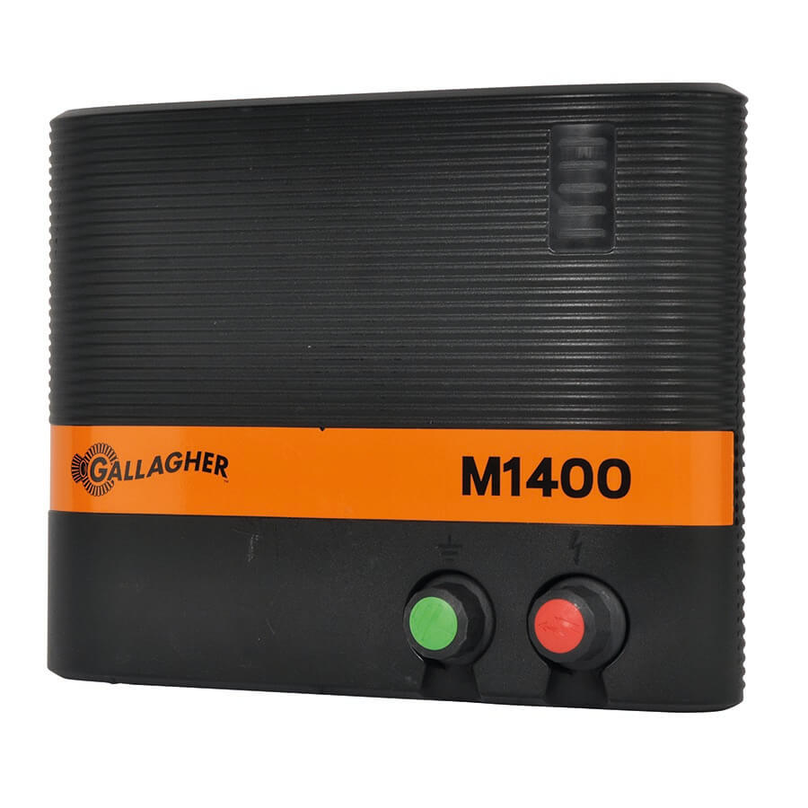 Gallagher M1400 mains electric fence energiser with a black body, orange detailing, and green and red buttons on the front panel.