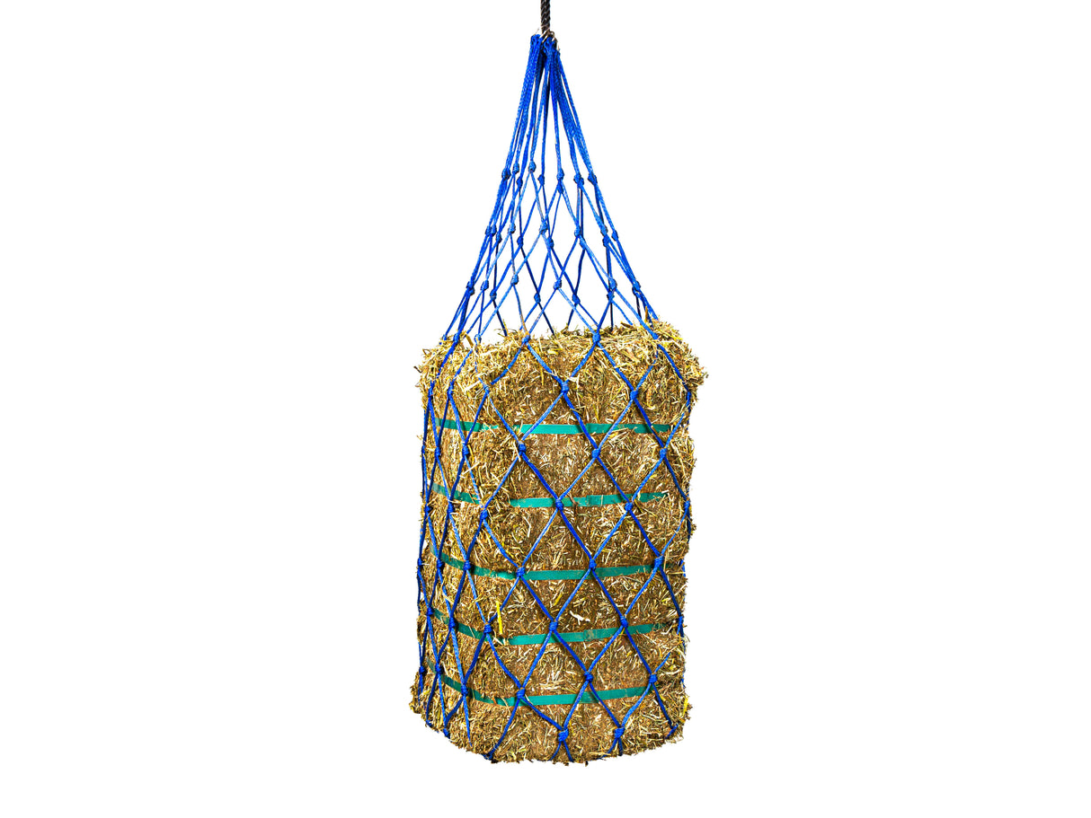 A blue synthetic hay net with holes and metal rings, filled with hay, designed to suspend Lucerne bales.