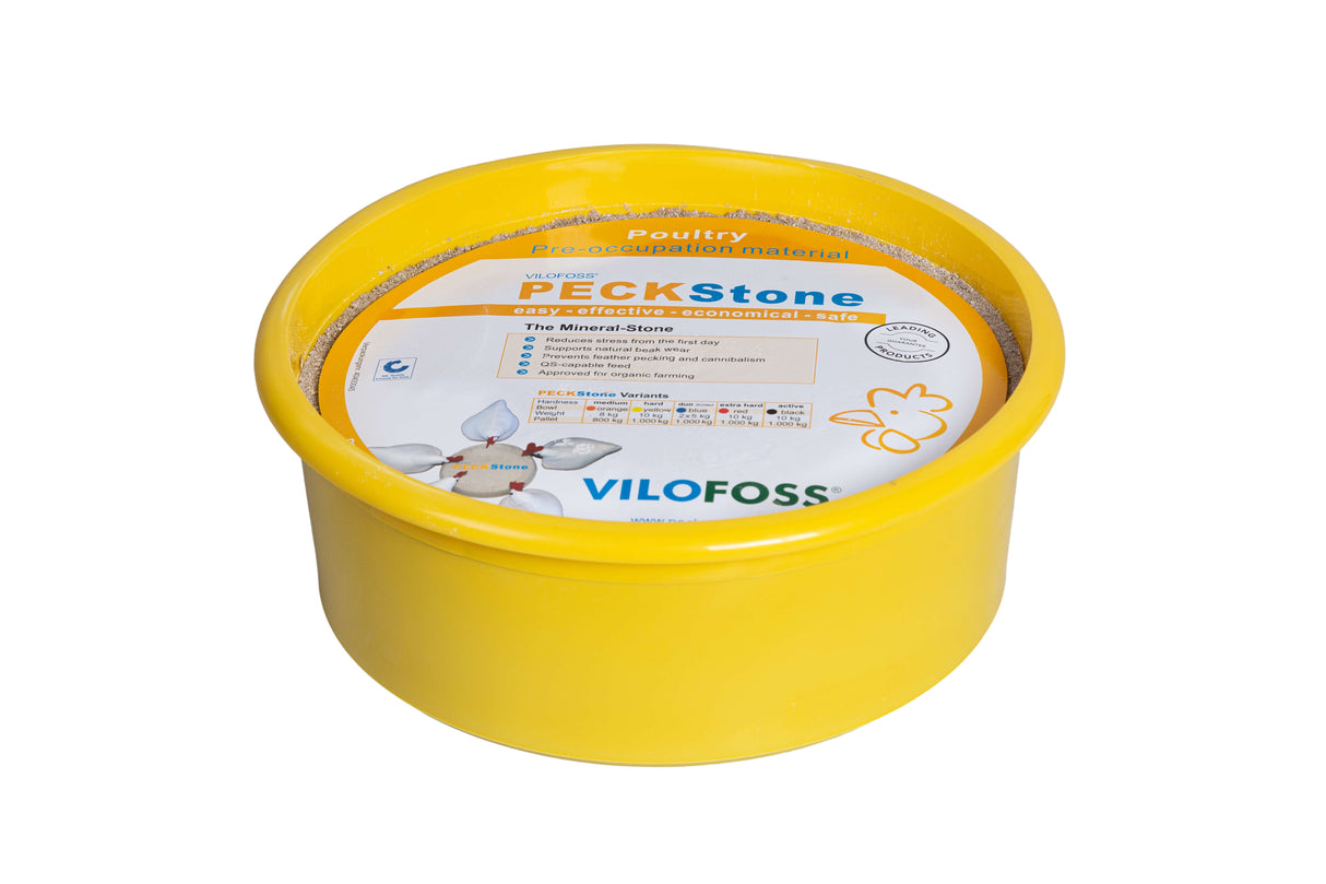A yellow plastic tub of PECKStone mineral block for poultry, with branding and product information on the label.