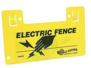 A yellow warning sign for an electric fence with black text and graphics, including the brand name 'Gallagher' printed on it.
