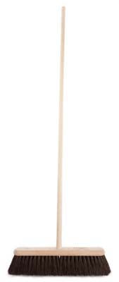 An industrial/construction broom with a wooden platform stock filled with medium Gumati fibre, trimmed at 89mm, and supplied with a handle.