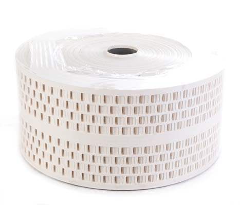 A roll of white plastic egg belt with square holes, used for poultry farming equipment.
