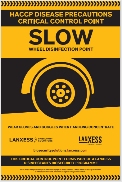A yellow and black sign with text and graphics indicating it is a wheel disinfection point, asking to wear gloves and goggles when handling concentrate.