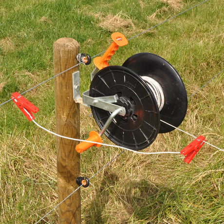 Gallagher Fence wire reel attached to a wooden post