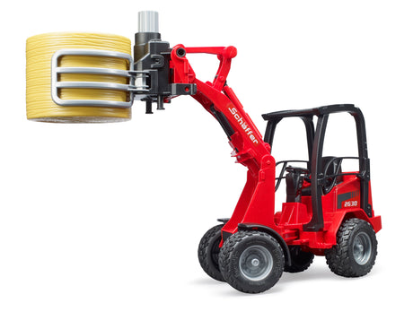 Schäffer Compact loader 2630 with bale gripper plus bale - Farm Toy