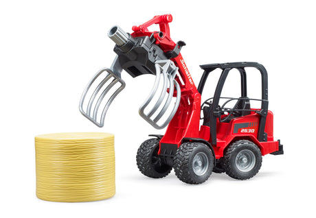 Schäffer Compact loader 2630 with bale gripper plus bale - Farm Toy