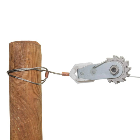 Metal pulley system attached to a wooden post on a white background