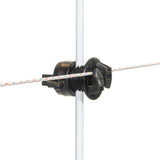 A black Gallagher screw-on rod insulator mounted on a white fence post, designed to add extra wire to the post.